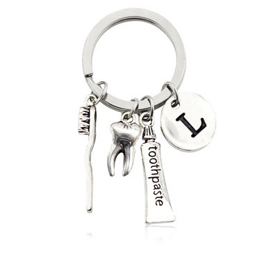 Radoša personība 26 vēstules ar zobu birstes zobu pastu Atslēgu piekariņš Zobi Veselības aizsardzības izpratne Piemiņas rotaslietas