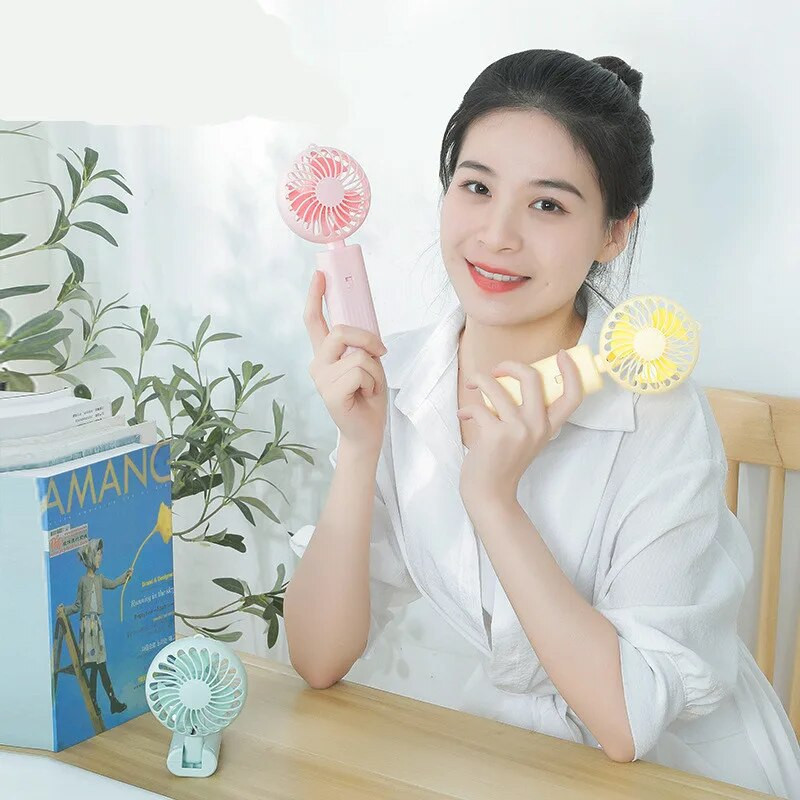 Jauns salokāms rokas mazs ventilators Mini portatīvais galda ventilators Vienkārša forma, spēcīgs vēja ātrums, darbina divas AA baterijas