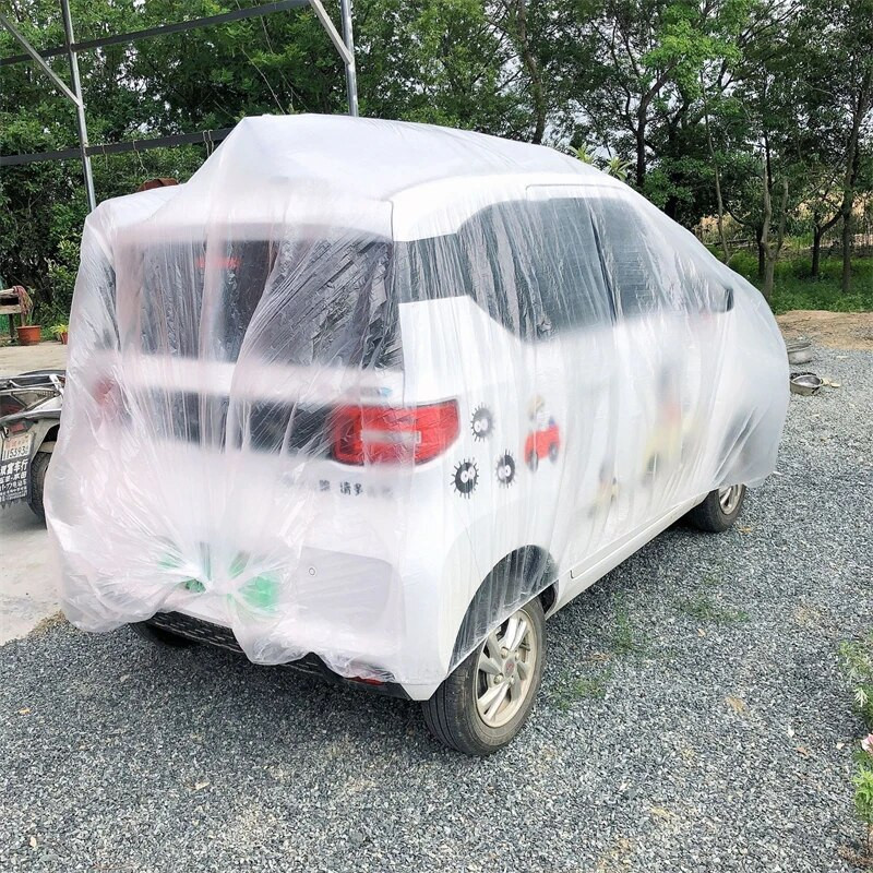 Caurspīdīgs automašīnas pārsegs Universal Car Cover Ūdensizturīgs Putekļu necaurlaidīgs Vienreizējās lietošanas automašīnas Pārvalki Izmērs M-XL Caurspīdīgi plastmasas automašīnu pārsegi