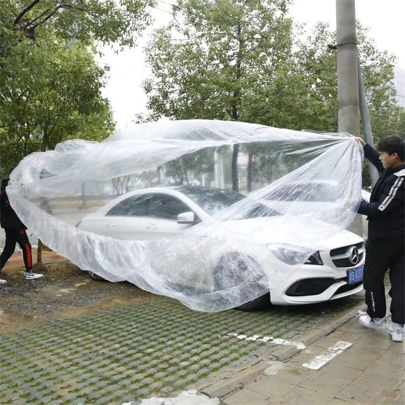 Caurspīdīgs automašīnas pārsegs Universal Car Cover Ūdensizturīgs Putekļu necaurlaidīgs Vienreizējās lietošanas automašīnas Pārvalki Izmērs M-XL Caurspīdīgi plastmasas automašīnu pārsegi
