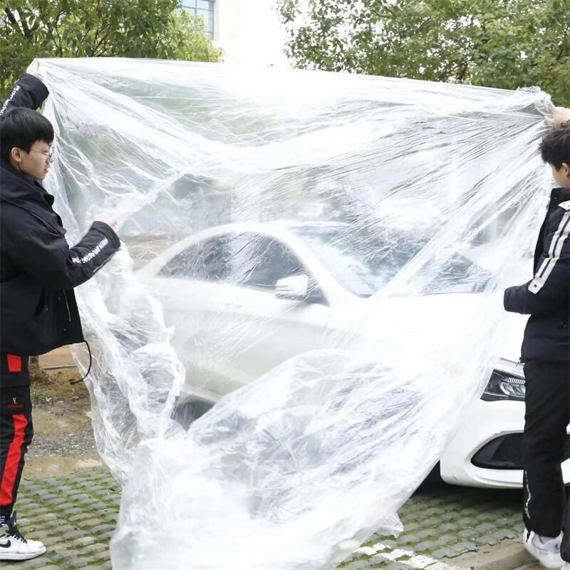 Caurspīdīgs automašīnas pārsegs Universal Car Cover Ūdensizturīgs Putekļu necaurlaidīgs Vienreizējās lietošanas automašīnas Pārvalki Izmērs M-XL Caurspīdīgi plastmasas automašīnu pārsegi
