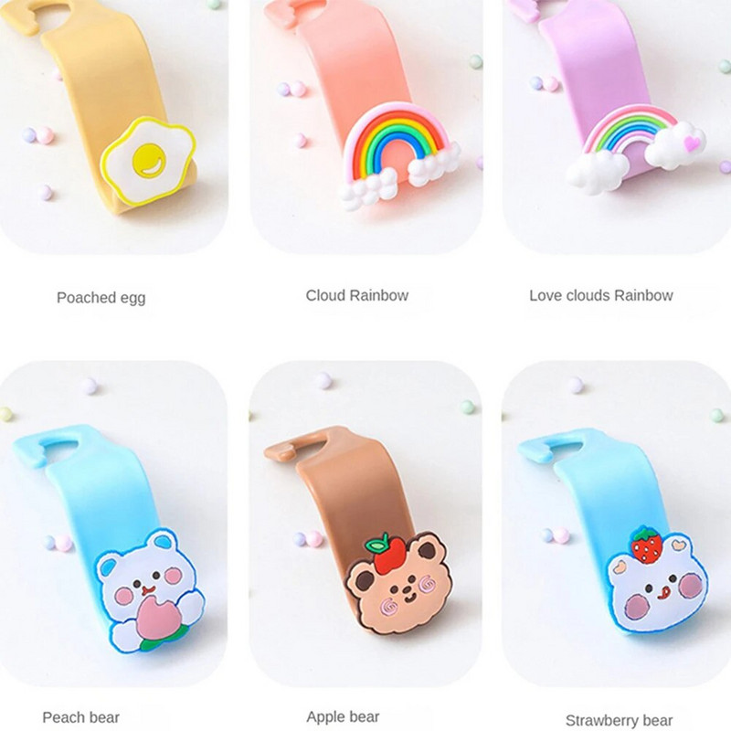 Karikatūra Automašīnas sēdekļa pakaramais Āķis Maska Somas aksesuāri Turētājs Āķis Bez štancēšanas Vietu taupošs automašīnas organizatora statīvs Somas statīvs