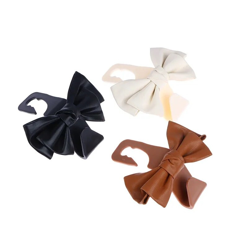 Automašīnas sēdekļa atzveltnes āķis Bowknot glabāšanas āķis PU ādas modes soma Daudzfunkcionālas dažādas lietas muguras glabāšanas āķis interjera aksesuāri