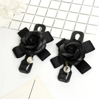 Daudzfunkcionālas glabāšanas priekšgala āķis automašīnas sēdekļa atzveltnes āķim Dažādi jauki aizmugurējā sēdekļa novietošanas rīki Salona piederumi