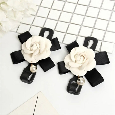 Daudzfunkcionālas glabāšanas priekšgala āķis automašīnas sēdekļa atzveltnes āķim Dažādi jauki aizmugurējā sēdekļa novietošanas rīki Salona piederumi