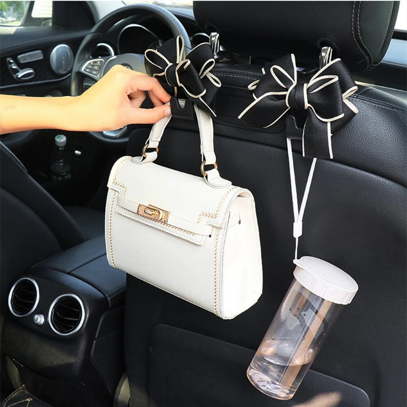Daudzfunkcionālas glabāšanas priekšgala āķis automašīnas sēdekļa atzveltnes āķim Dažādi jauki aizmugurējā sēdekļa novietošanas rīki Salona piederumi