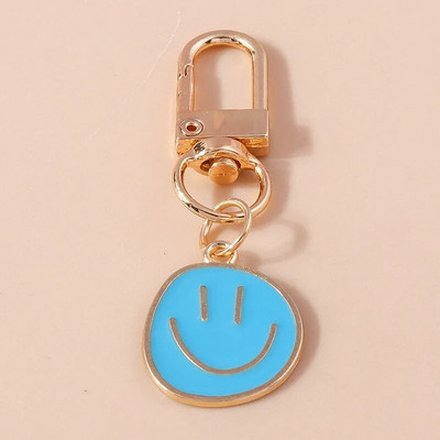 Armas naeratava näo võtmehoidja armas valge lilla kollane roosa sinine must emailiga metallist võtmehoidja koti aksessuaarid naistele