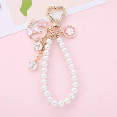 Magusa roosa kirsiõie fänn Jänese lint pärliga võtmehoidja naiste loominguline südame võtmehoidja kott ripats ehted tüdrukutele