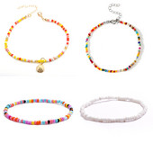 Jaunas, rokām darinātas, fāzēm rotātas potītes rokassprādzes varavīksnes krāsā elastīgas potītes rokassprādzes uz kājas pēdas pludmales rotaslietas