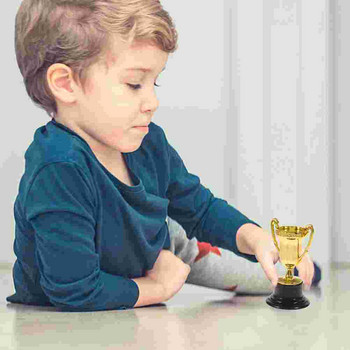 Трофей Трофеи Награда Детски играчки Мини пластмасови спортни Златна футболна купа Награда Победител Футболна детска играчка Бейзболни награди Чаши