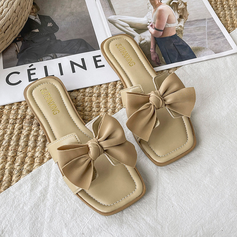 Suvised suured sussid naistele, lamedad 2023. aasta uued ühevärvilised tippklassi haldjastiilis naiste vibu sandaalid, PU