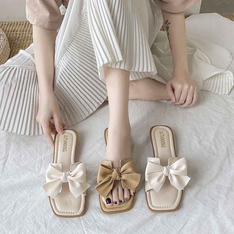 Suvised suured sussid naistele, lamedad 2023. aasta uued ühevärvilised tippklassi haldjastiilis naiste vibu sandaalid, PU