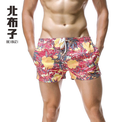 Jauni vīriešu galda šorti peldkostīmi, ātri žūstoši pludmales īsās ikdienas bikses — modes izvēle ar apdruku