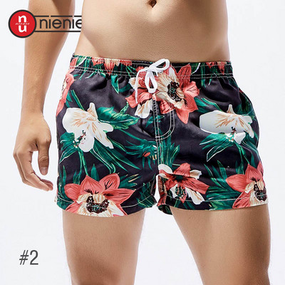Jauni vīriešu galda šorti peldkostīmi, ātri žūstoši pludmales īsās ikdienas bikses — modes izvēle ar apdruku