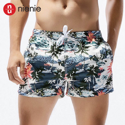 Jauni vīriešu galda šorti peldkostīmi, ātri žūstoši pludmales īsās ikdienas bikses — modes izvēle ar apdruku