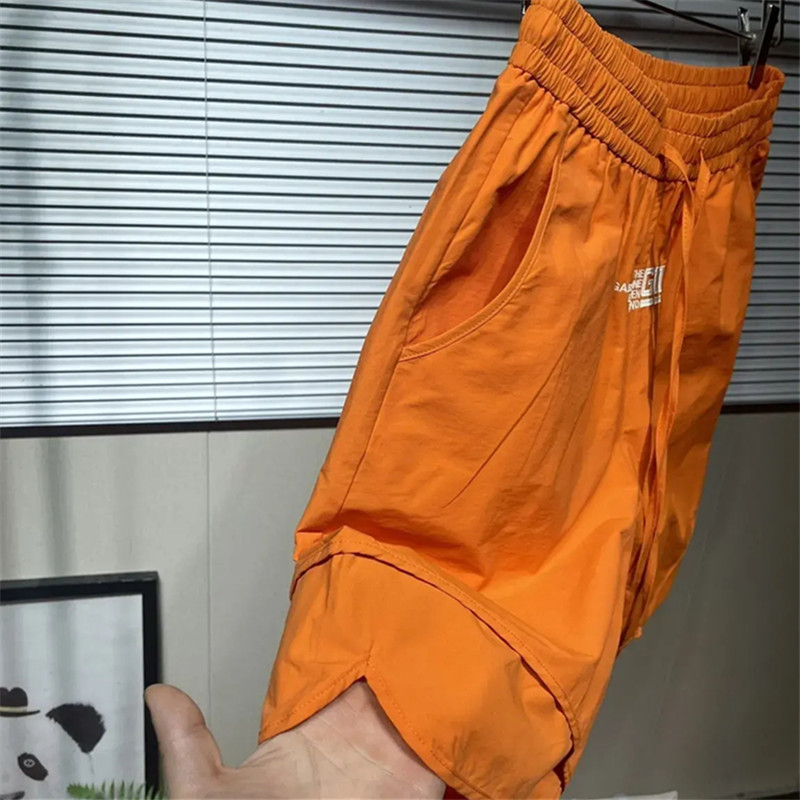 Sporta šorti Vīriešu 2024. gada vasara Jauni ātri žūstoši kravas šorti vīriešu kabatas personības ikdienišķas bikses, korejiešu modes sporta bikses