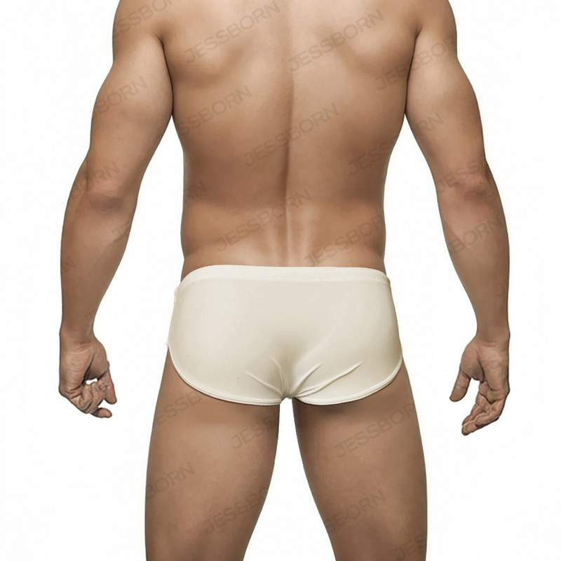 Vīriešu vienkrāsaini trīsstūra peldbikses ar stumjamu spilventiņu Eiropas amerikāņu modes bikini vasaras pludmales sērfošanas ātri nožūstoši šorti