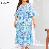 Odjeća velikih veličina Ženska midi haljina s V-izrezom i šarenim volanima s plisiranim plisiranim motivima kratkih rukava za plažu.