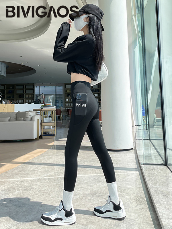 BIVIGAOS Pavasara vasara Jauni sieviešu sānu kabatas burtu legingi haizivīdas legingi ar augstu vidukli Skinny Slim sporta skriešanas fitnesa legingi