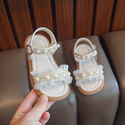 Uus suvise stiiliga moodsad mugavad ja vabaaja lameda tallaga helmestega ühe rihmaga libisemiskindlad lahtise varbaga tüdrukute kulumiskindlad sandaalid