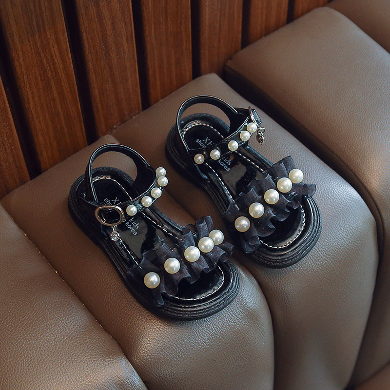 Uus suvise stiiliga moodsad mugavad ja vabaaja lameda tallaga helmestega ühe rihmaga libisemiskindlad lahtise varbaga tüdrukute kulumiskindlad sandaalid