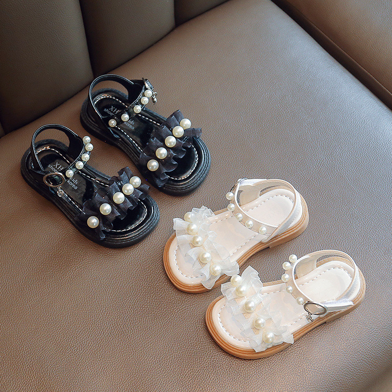 Uus suvise stiiliga moodsad mugavad ja vabaaja lameda tallaga helmestega ühe rihmaga libisemiskindlad lahtise varbaga tüdrukute kulumiskindlad sandaalid