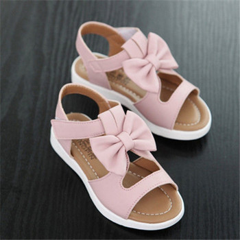 Детски обувки 2023 Летни кухи плоски сандали Сладък лък Твърди обувки за момичета Бебешки римски сандали Ежедневни плажни обувки с мека подметка Сандалии