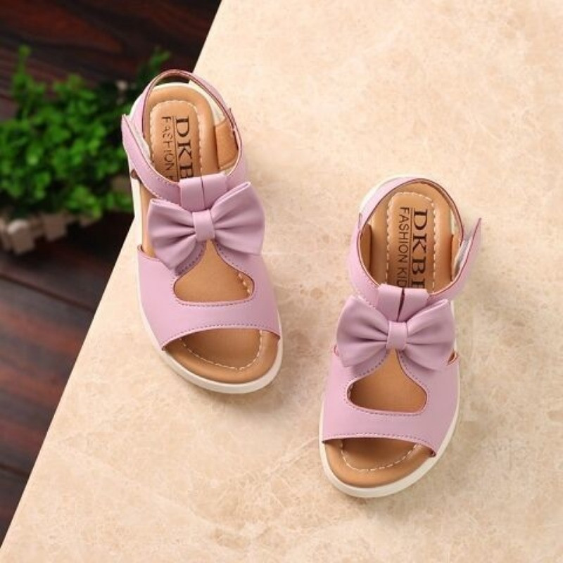 Lastekingad 2023 Suvised õõnsad lamedad sandaalid Sweet Bow Solid Girl Kings Baby Room sandaalid Vabaaja pehme tallaga rannakingad Sandaalid