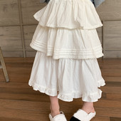 2024. gada pavasara meitenes daudzpusīgi balti svārki korejiešu stila rudens princeses slāņaini mežģīņu malas žakarda kūkas svārki vidēja garuma