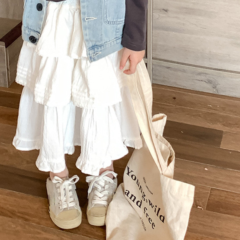 2024. gada pavasara meitenes daudzpusīgi balti svārki korejiešu stila rudens princeses slāņaini mežģīņu malas žakarda kūkas svārki vidēja garuma