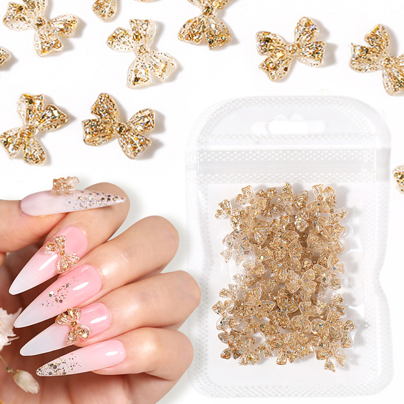 50gab. 3D gaismas nagu piekariņi, aksesuāri, želejas lentes, bantītes, nagu mākslas rotājumi, caurspīdīgi kristāla manikīra rotaslietas