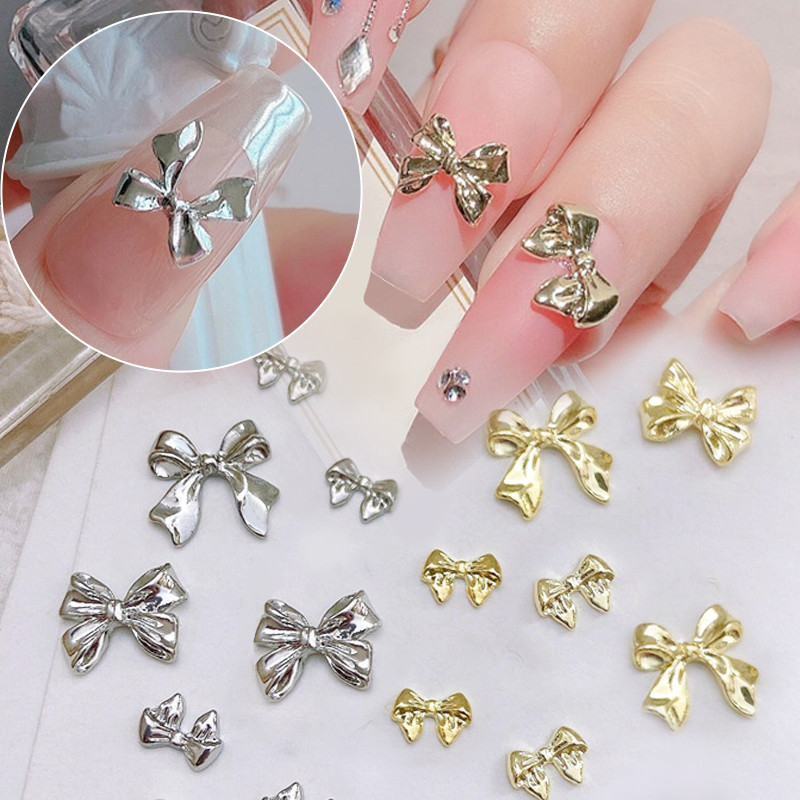 10 komada 3D srebrni zlatni leptir nakit Nail Art nitne Modni ženski privjesci za nokte Bowknot Srce Nokti Rhinestones Dekoracija za manikuru