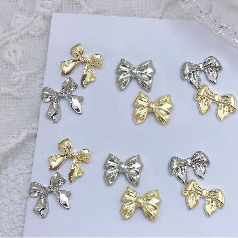 10 komada 3D srebrni zlatni leptir nakit Nail Art nitne Modni ženski privjesci za nokte Bowknot Srce Nokti Rhinestones Dekoracija za manikuru