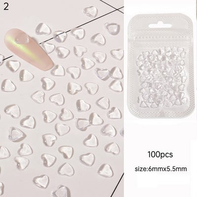 100 gab. 3D caurspīdīgs kalnu kristāls mīlestības sirds piekariņi nagu mākslas dekorēšanai, dzidru sveķu nagu piekariņi Juvelierizstrādājumu manikīra aksesuāri