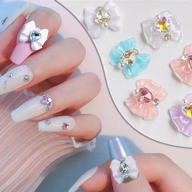 10 gab. Lentes Sveķu Bowknot Spīdīgas Nagu daļas Sakausējums Sirds Rhinestone Butterfly Nagu piekariņi nagu dekorēšanai Piederumi Izejmateriāli