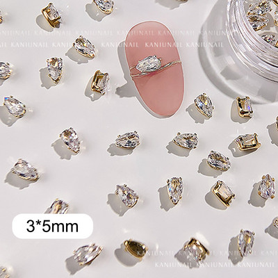 40 gab. Spīdīga kristāla 3D nagu mākslas kalnu strēles rotājumi forma plakana stikla dimanta rotaslietas dizaina manikīra aksesuāri