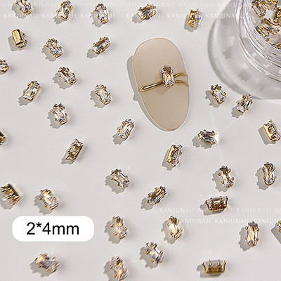 40 gab. Spīdīga kristāla 3D nagu mākslas kalnu strēles rotājumi forma plakana stikla dimanta rotaslietas dizaina manikīra aksesuāri