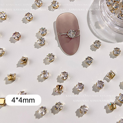 40 gab. Spīdīga kristāla 3D nagu mākslas kalnu strēles rotājumi forma plakana stikla dimanta rotaslietas dizaina manikīra aksesuāri