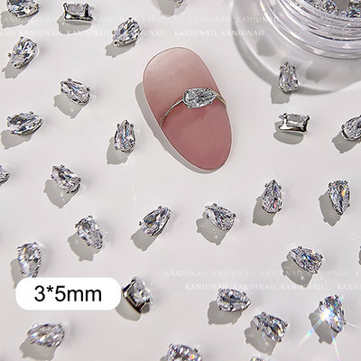 40 gab. Spīdīga kristāla 3D nagu mākslas kalnu strēles rotājumi forma plakana stikla dimanta rotaslietas dizaina manikīra aksesuāri