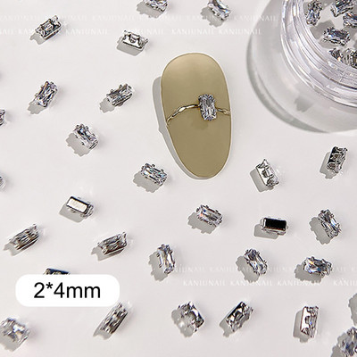 40 gab. Spīdīga kristāla 3D nagu mākslas kalnu strēles rotājumi forma plakana stikla dimanta rotaslietas dizaina manikīra aksesuāri