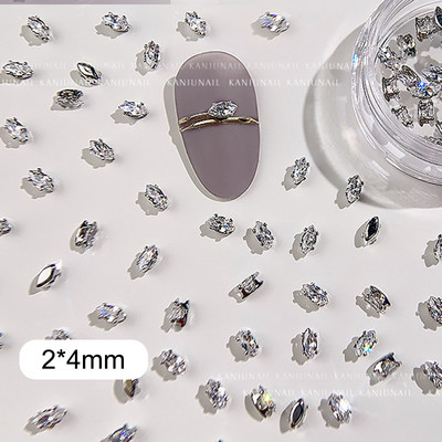 40 gab. Spīdīga kristāla 3D nagu mākslas kalnu strēles rotājumi forma plakana stikla dimanta rotaslietas dizaina manikīra aksesuāri