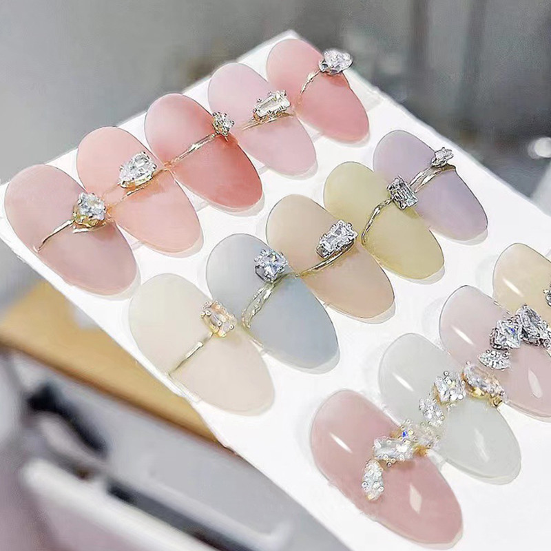 40 gab. Spīdīga kristāla 3D nagu mākslas kalnu strēles rotājumi forma plakana stikla dimanta rotaslietas dizaina manikīra aksesuāri