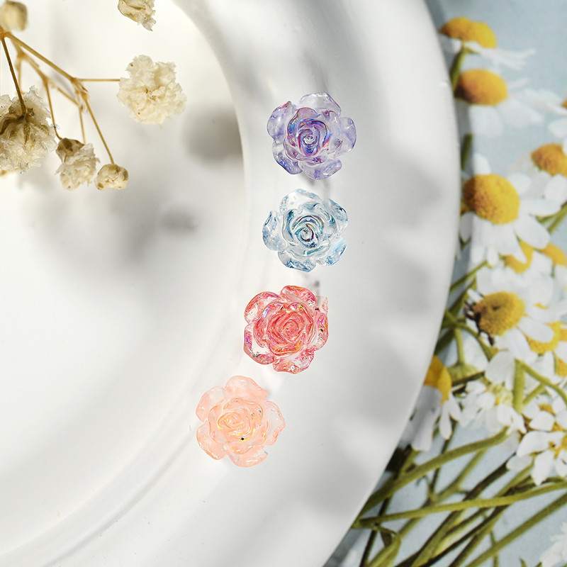 100 gab. Sveķu mirdzoša roze, plakans muguras zieds, kalnu strēles dārgakmens, arilka kamēlija, rotaslietas, kāzu figūriņas, aplikācijas, amatniecības izstrādājumi.