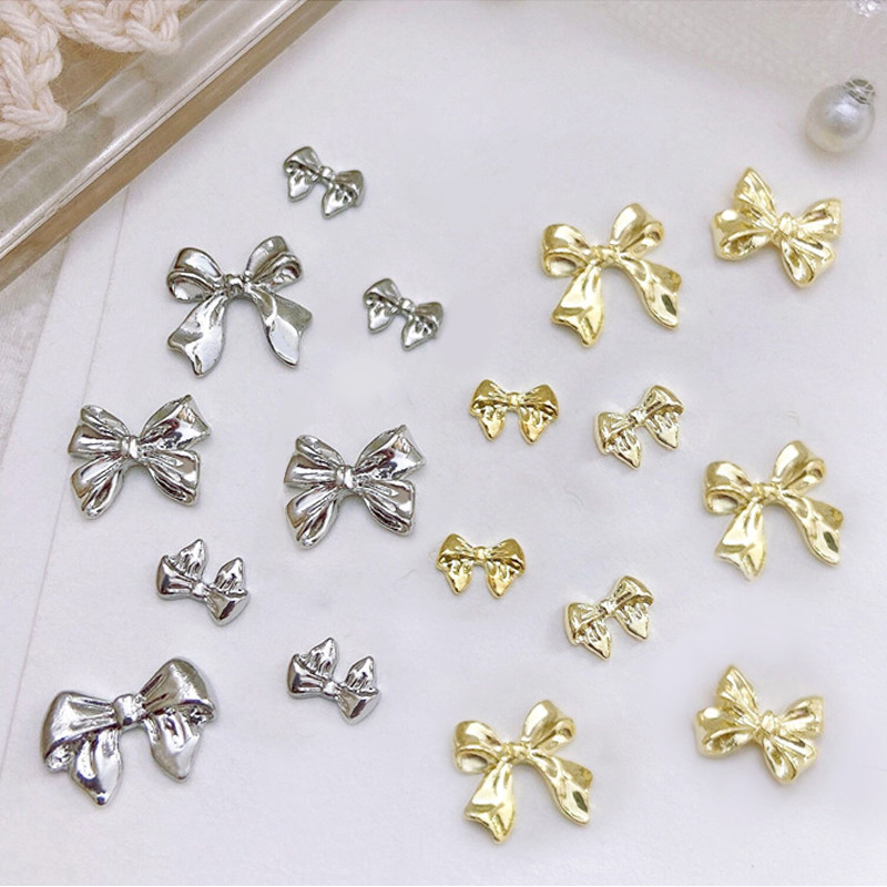 10 gab. Jaukti metāla sakausējums Bownot Naglas Māksla Dekorācija Sliver Gold Nail Piekariņi DIY Manikīrs Dizains Rotaslietas Aksesuāri Instrumenti