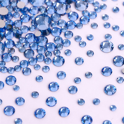 1440 gab./iepakojumā jaukta izmēra stikls plakana aizmugures kalnu strēles mirdzoša, apaļa, zila dimanta līme bez fiksācijas līme uz rhinestones, lai izgatavotu nagu mākslu.