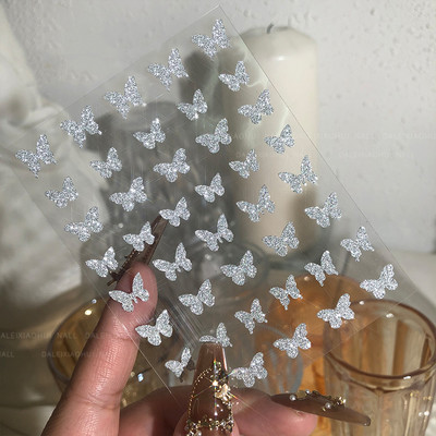 1Gb Laser Starburst Star līmējošā nagu uzlīme 3D nagu mākslas rotājums mirgojošs sudraba liesmas tauriņš nagu uzlīme, kas uzspiež uz nagiem