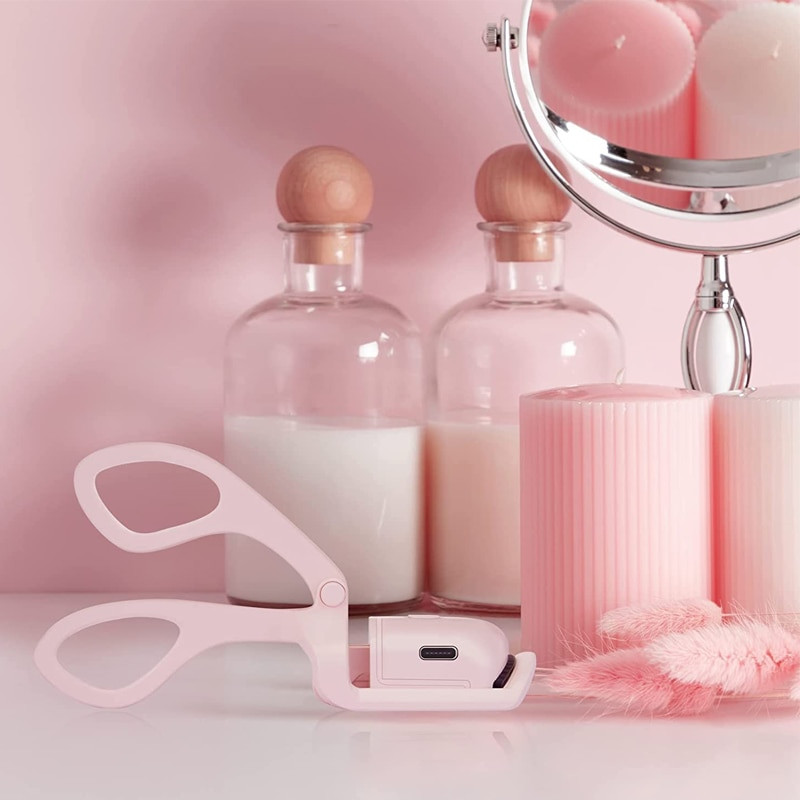 Rozā elektriskā skropstu atliecēja uzlādes modeļa ātras uzsildīšanas pārnēsājama veidošana un noturīga skropstu krokotāja klips