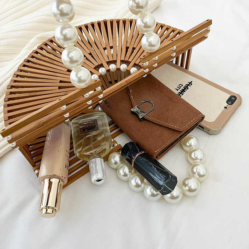 Visokokvalitetna ručna torba od bambusa Dizajn biserne ručke Ženska izdubljena torba za plažu Ljetni odmor Torba od slame Ženska torba